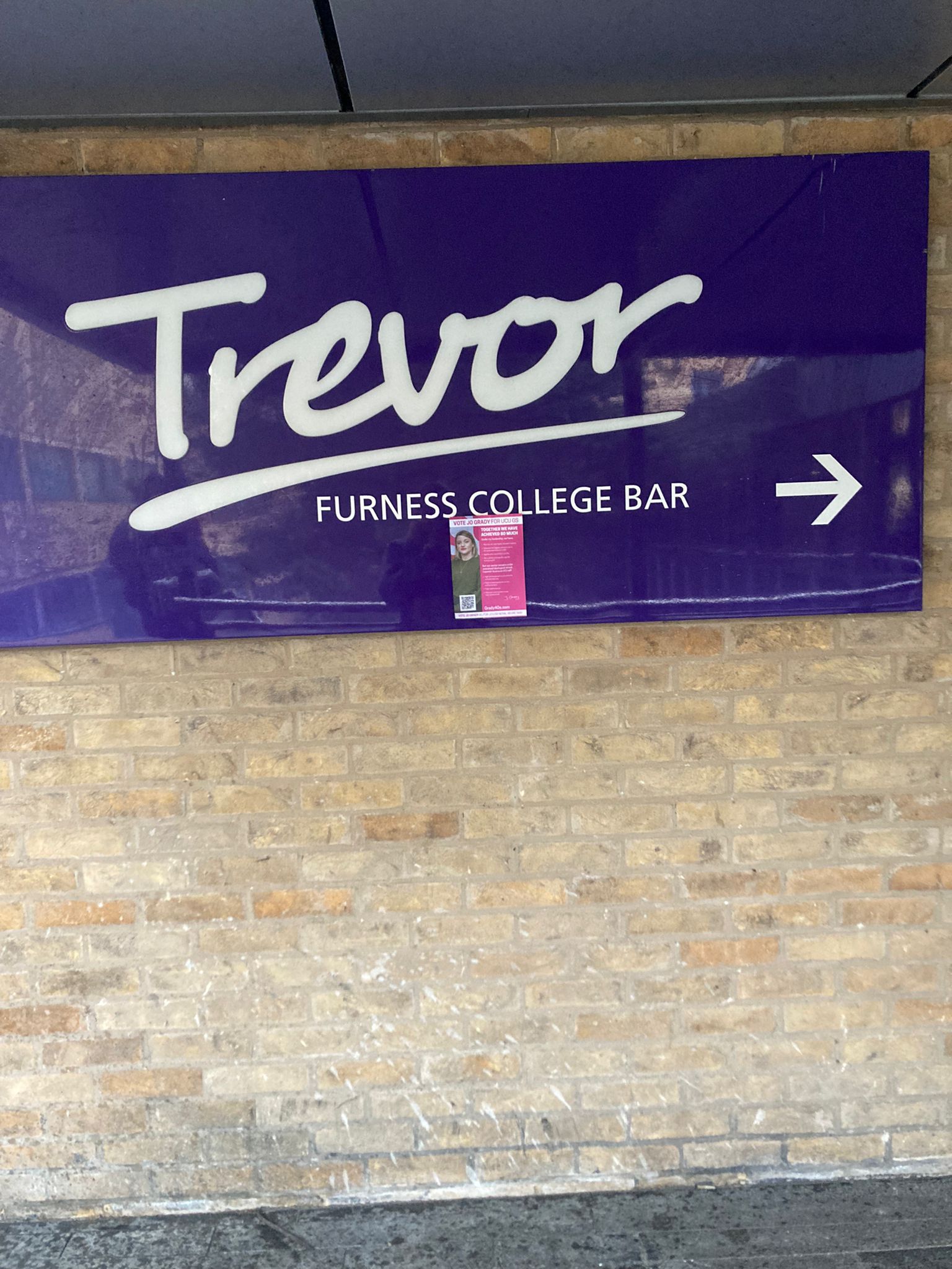 Grady4GS poster on a large purple sign that reads ‘Trevor Furness College Bar’