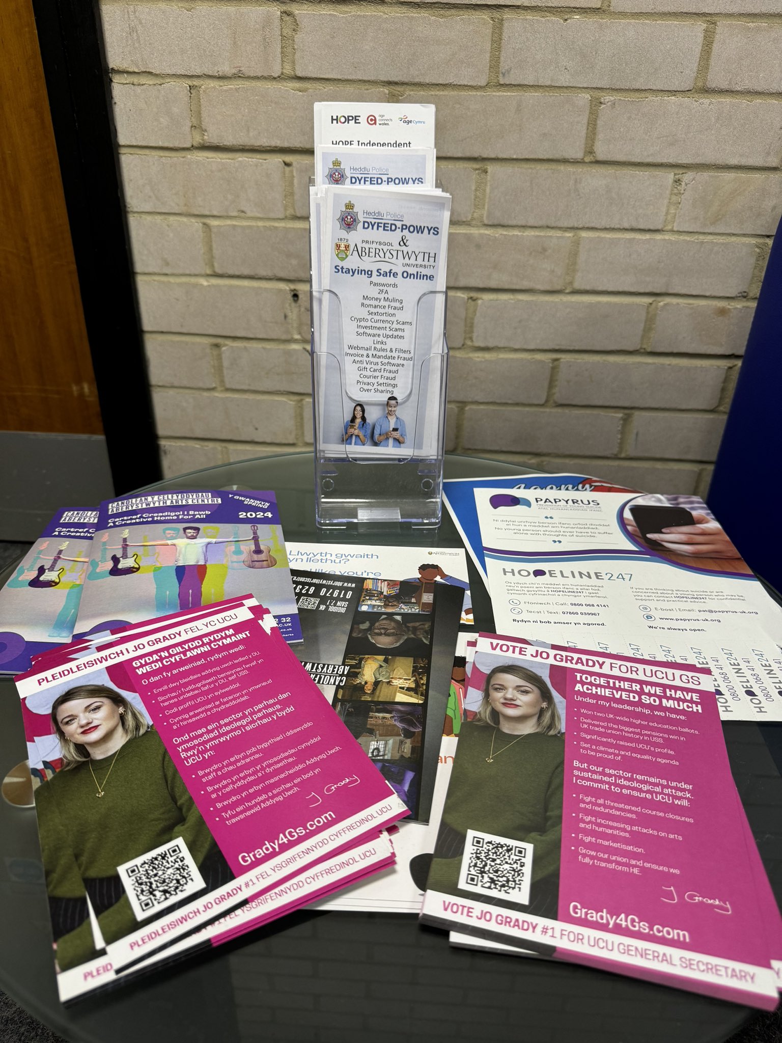 Grady4GS leaflets in English and Welsh on a table alongside other leaflets.