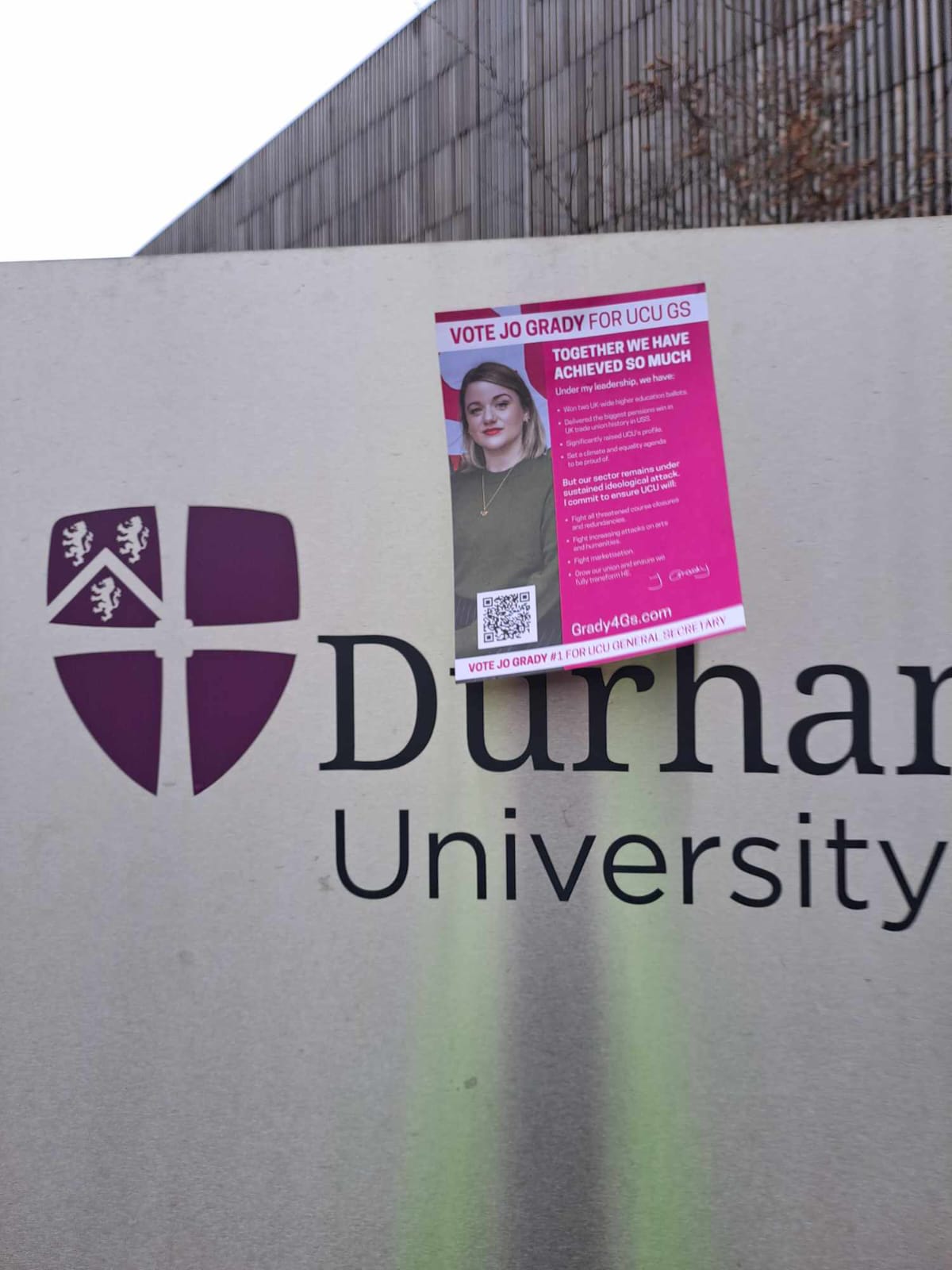 Grady4GS poster stuck on a large Durham University sign